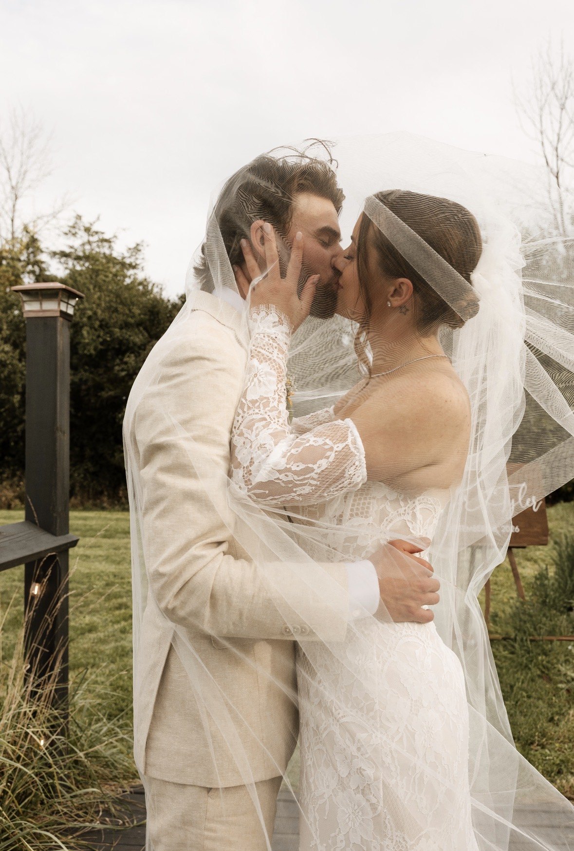 Bride and groom close together in golden light